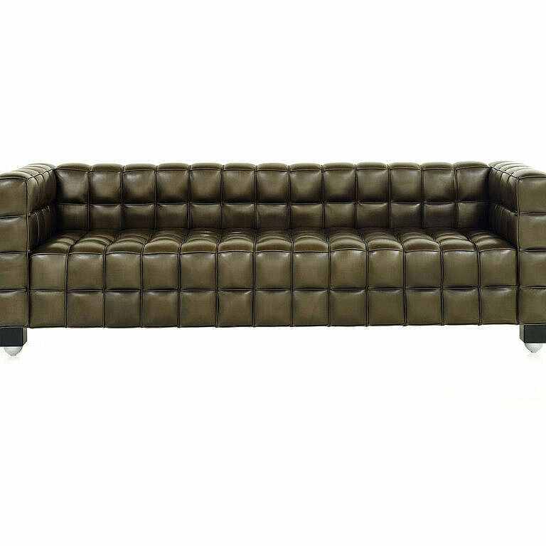 Kubus Sofa covered in olive colored leather
