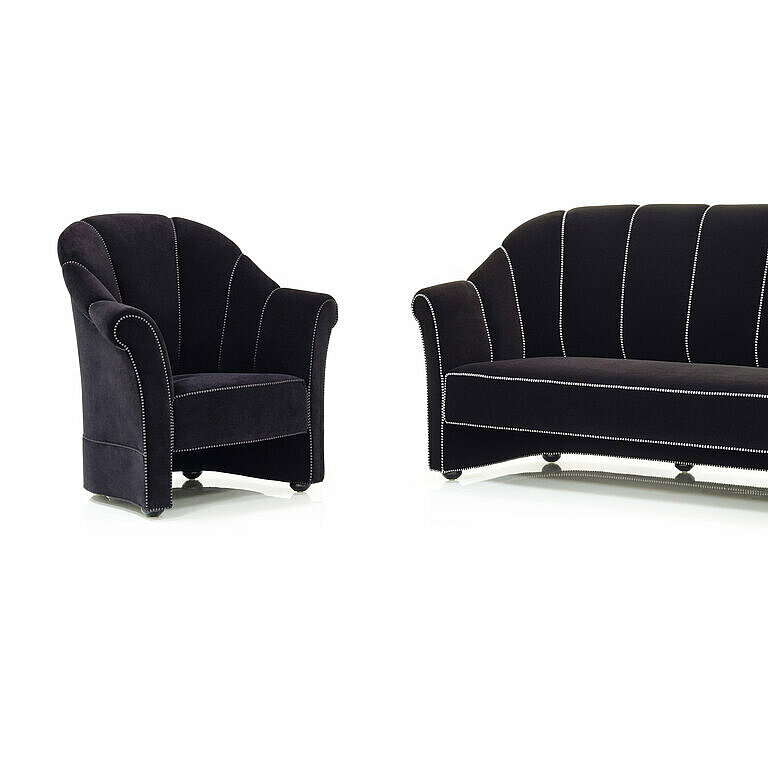 dark classic armchair and sofa