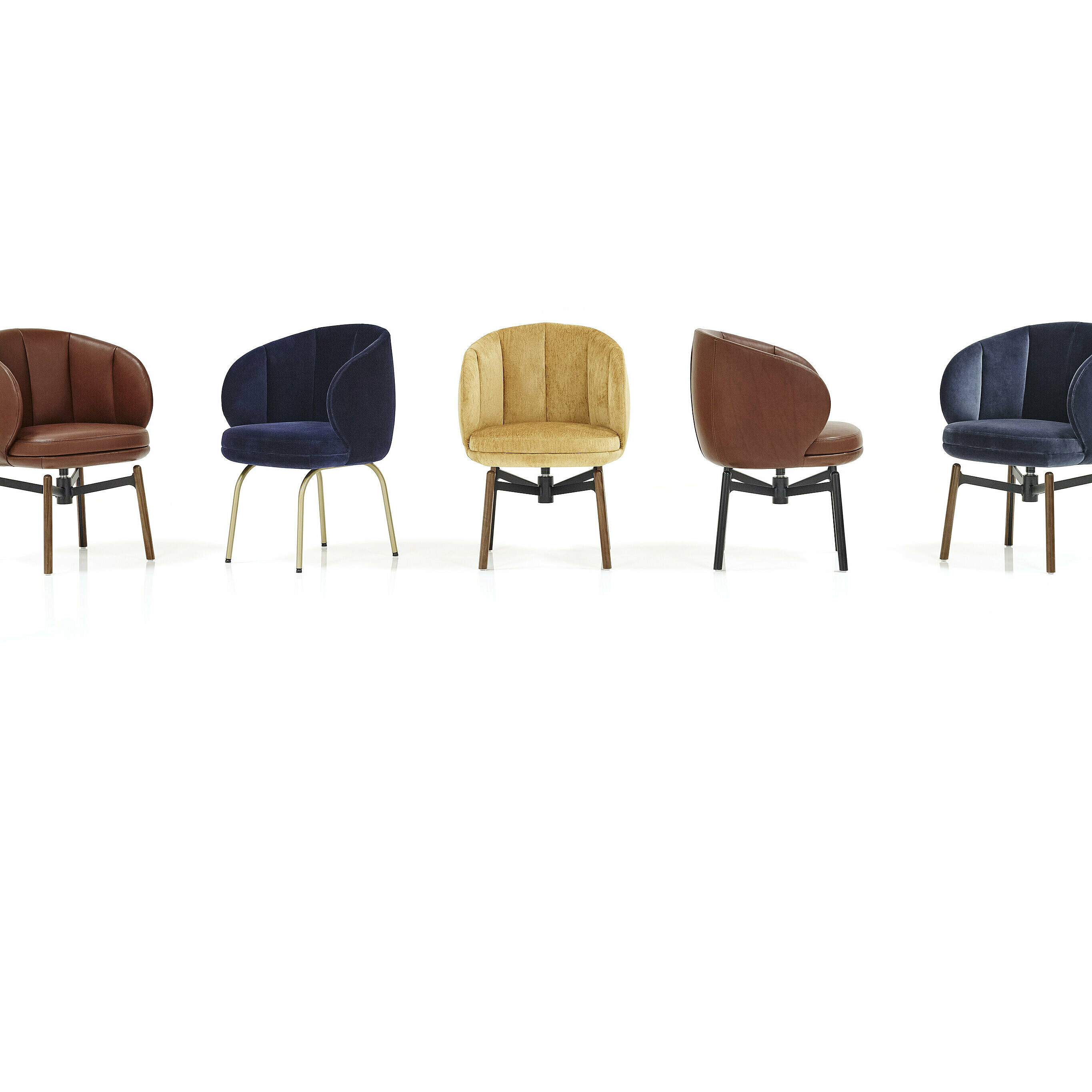 different upholstered Vuelta FD Chairs with 4-legged frame and swivel base with wooden legs