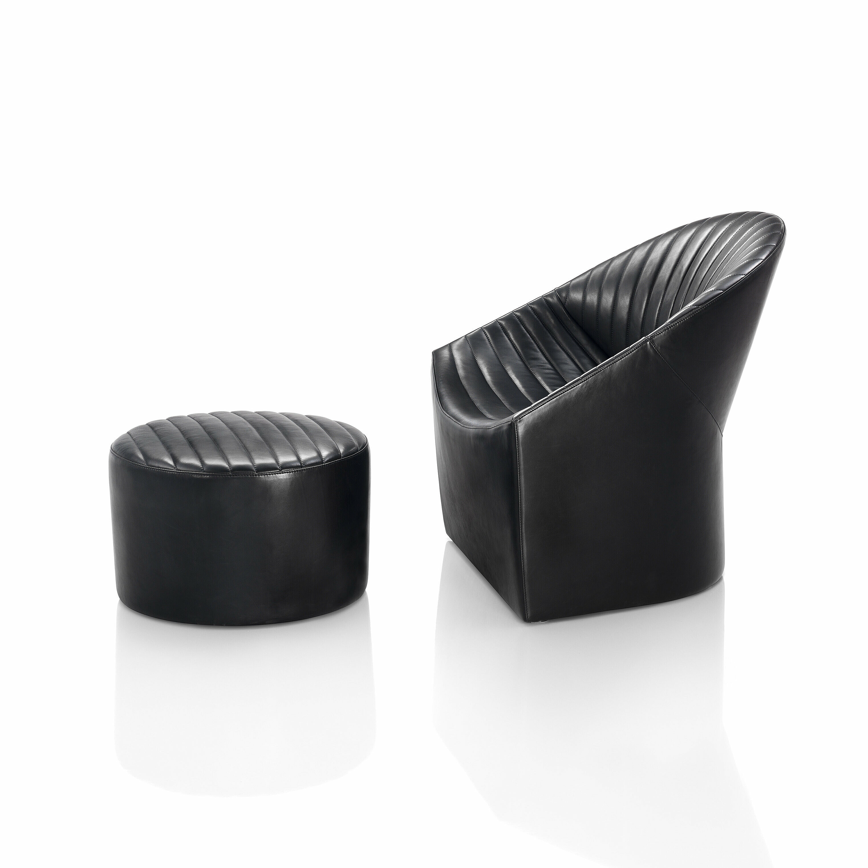 Oyster armchair and stool in black leather