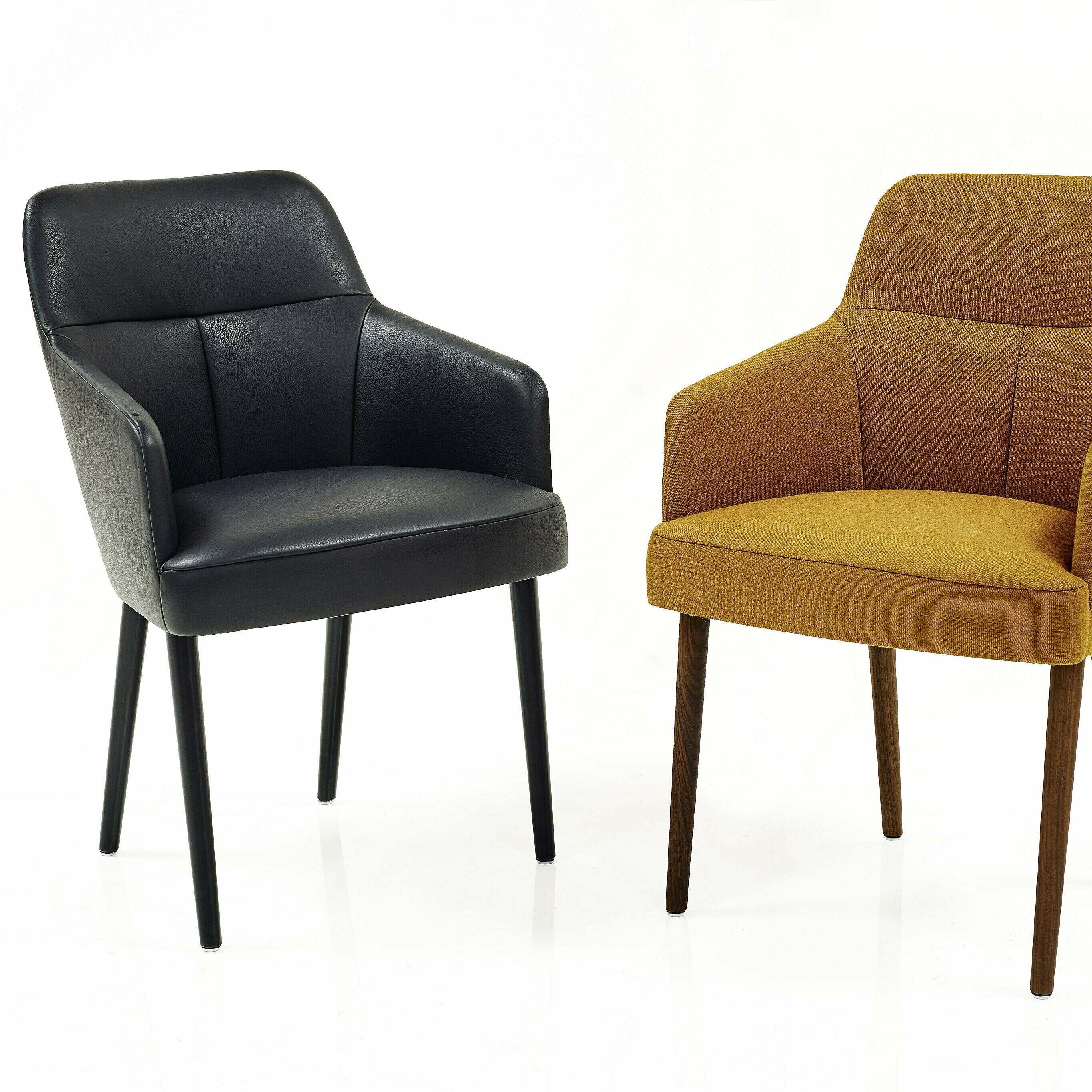two mono chairs covered with black velvet, from the front and from the side