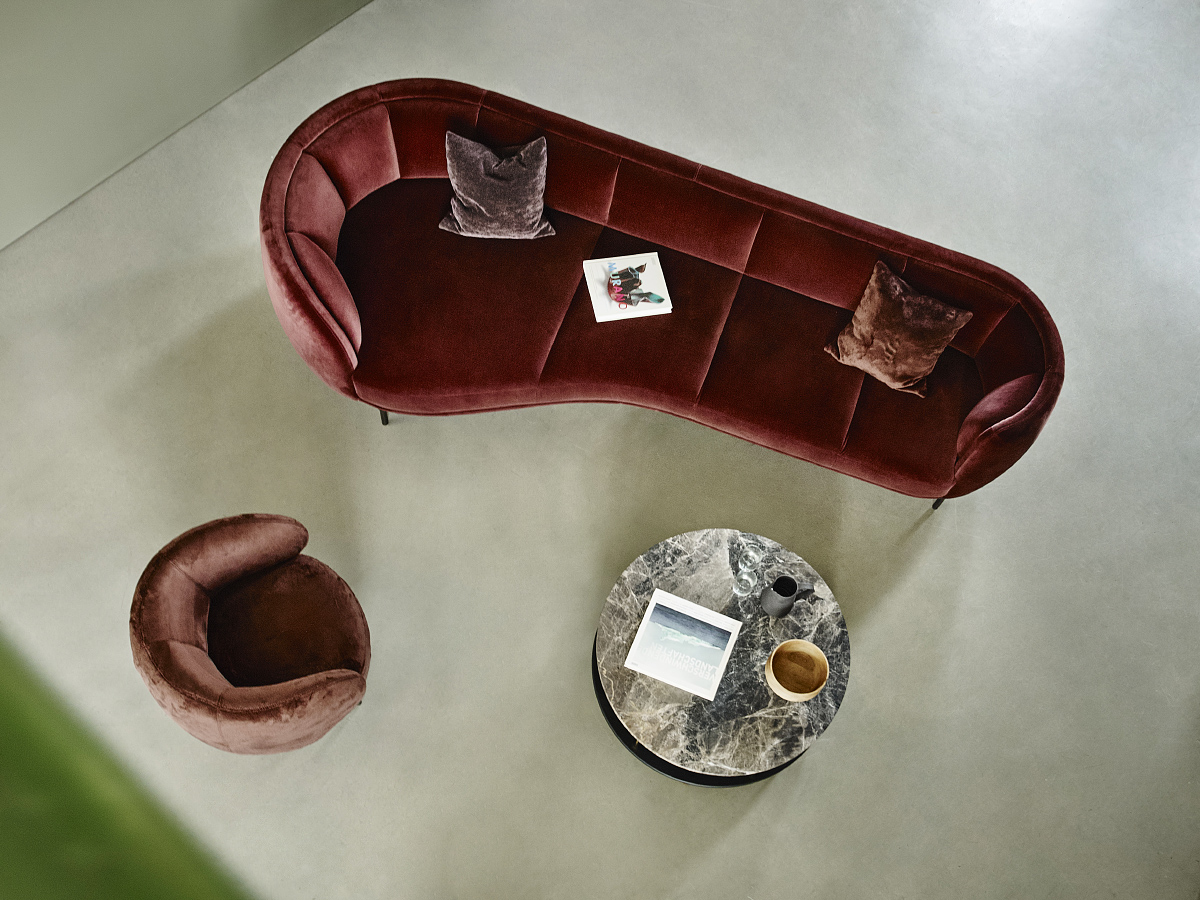 Vuelta lounge sofa 298 cm width covered in burgundy velvet, photographed from above