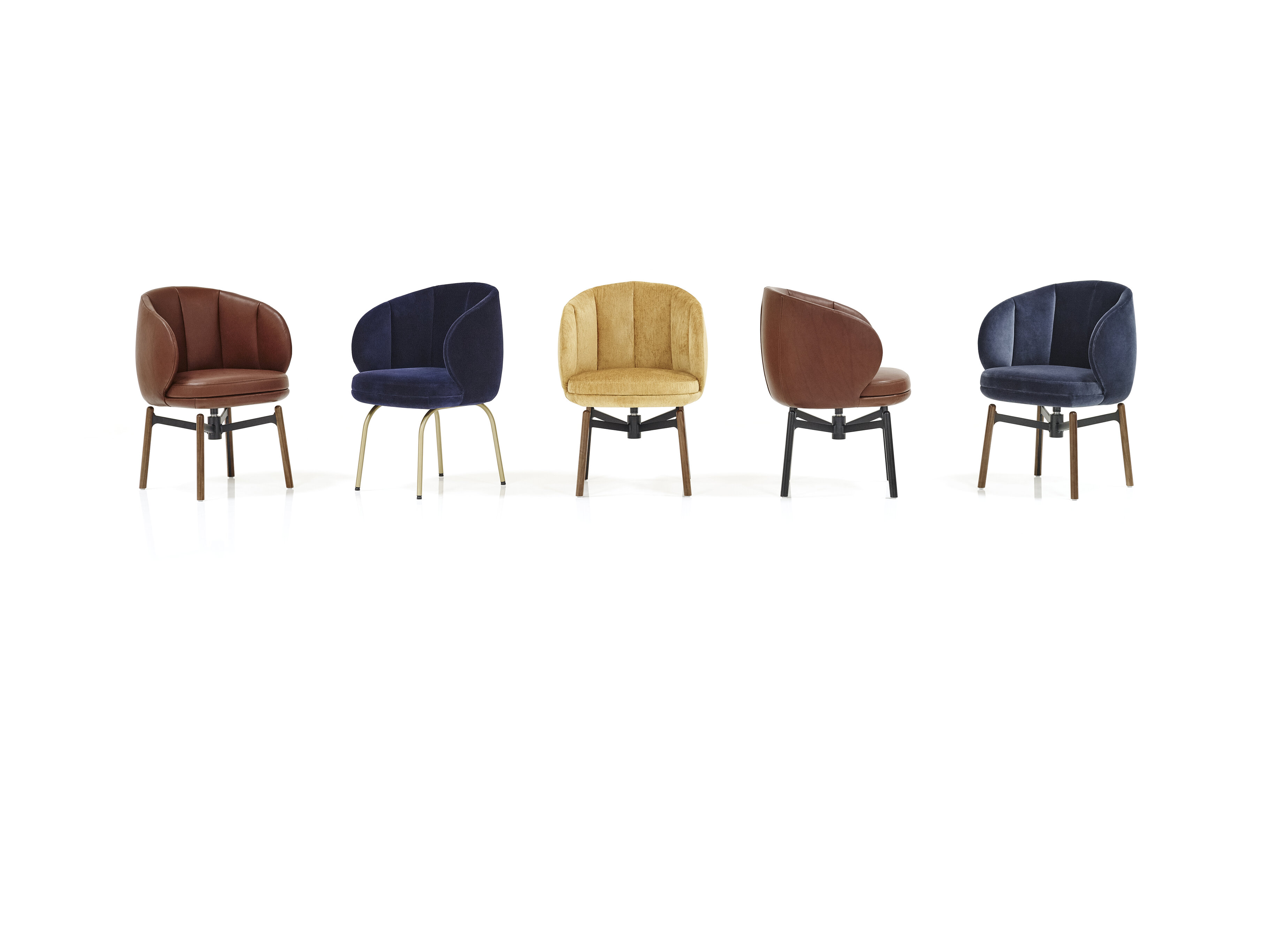 different upholstered Vuelta FD Chairs with 4-legged frame and swivel base with wooden legs
